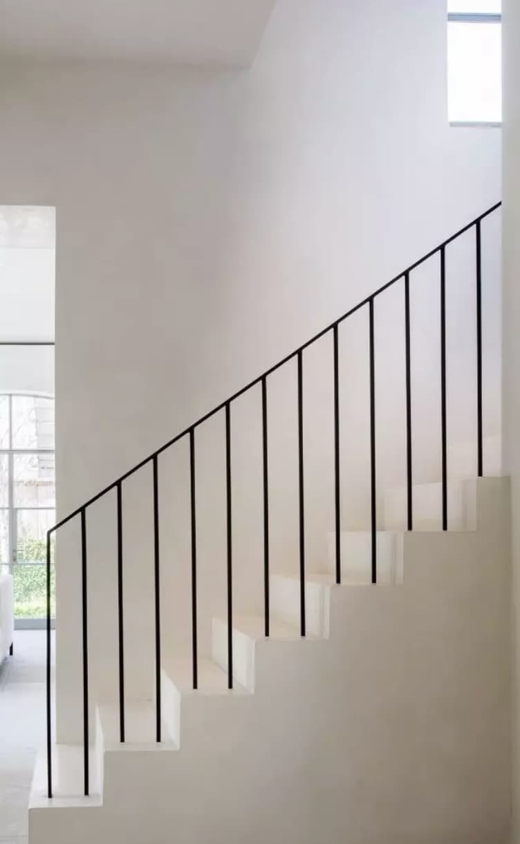 Slim black steel balustrade and handrail on a contemporary staircase
